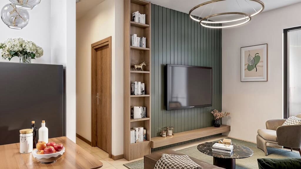 Modern living room interior with TV, bookshelf, and cozy seating area immersed in natural light from large window.